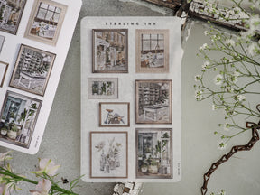 Collection of vintage sepia-toned picture frame stickers featuring a grid of architectural prints and European street scenes for journaling and scrapbooking.