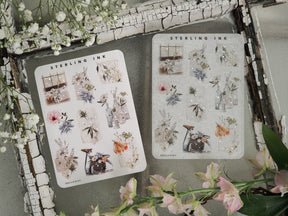 Large sheets of May 2023 icon stickers featuring vintage botanical arrangements, florals, and rustic objects highlighted with shimmering silver foil accents.