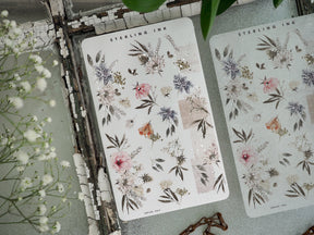 Romantic botanical washi stickers featuring clusters of soft blush pink roses, dusty lavender, and sage green foliage for scrapbooking.