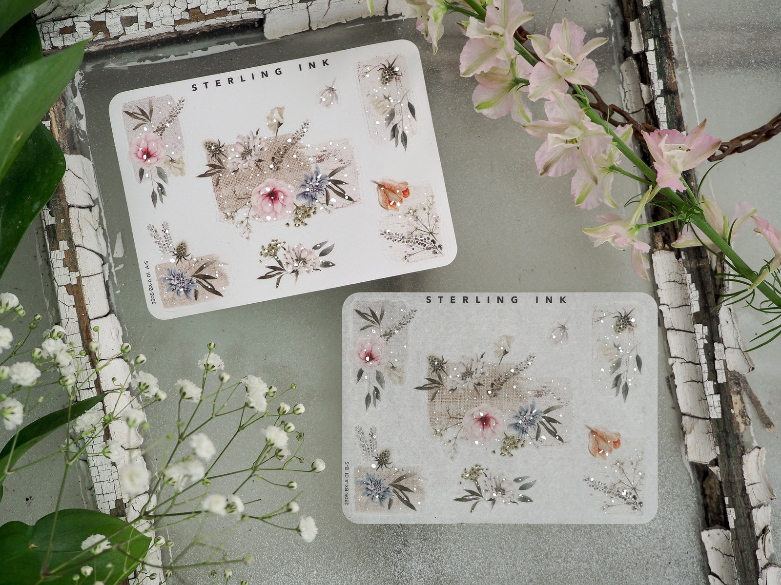 Decorative sticker sheets featuring vintage botanical bouquets, soft pastel flowers in pink and blue, and shimmering silver foil accents for journaling.