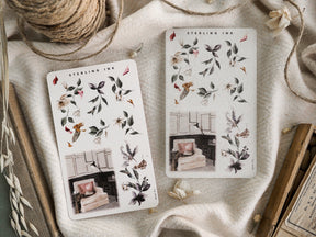 Muted botanical sticker sheets featuring detailed, watercolor illustrations of dried foliage, delicate flowers, and autumnal seasonal greenery.