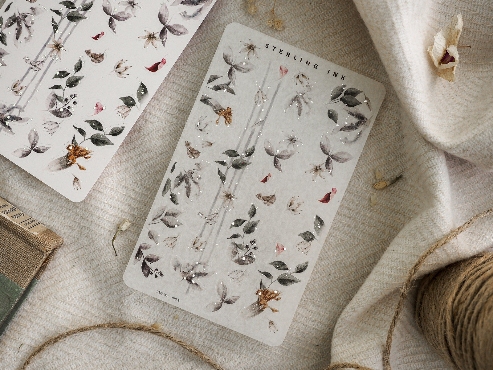 Muted botanical washi sticker sheet featuring clustered arrangements of dried leaves, tiny berries, and delicate seasonal autumn flora perfect for journaling.