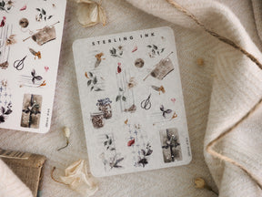 A detailed sticker sheet featuring delicate silver foil botanical icons, perfect for seasonal journaling and crafting with realistic depictions of winter leaves and flora.