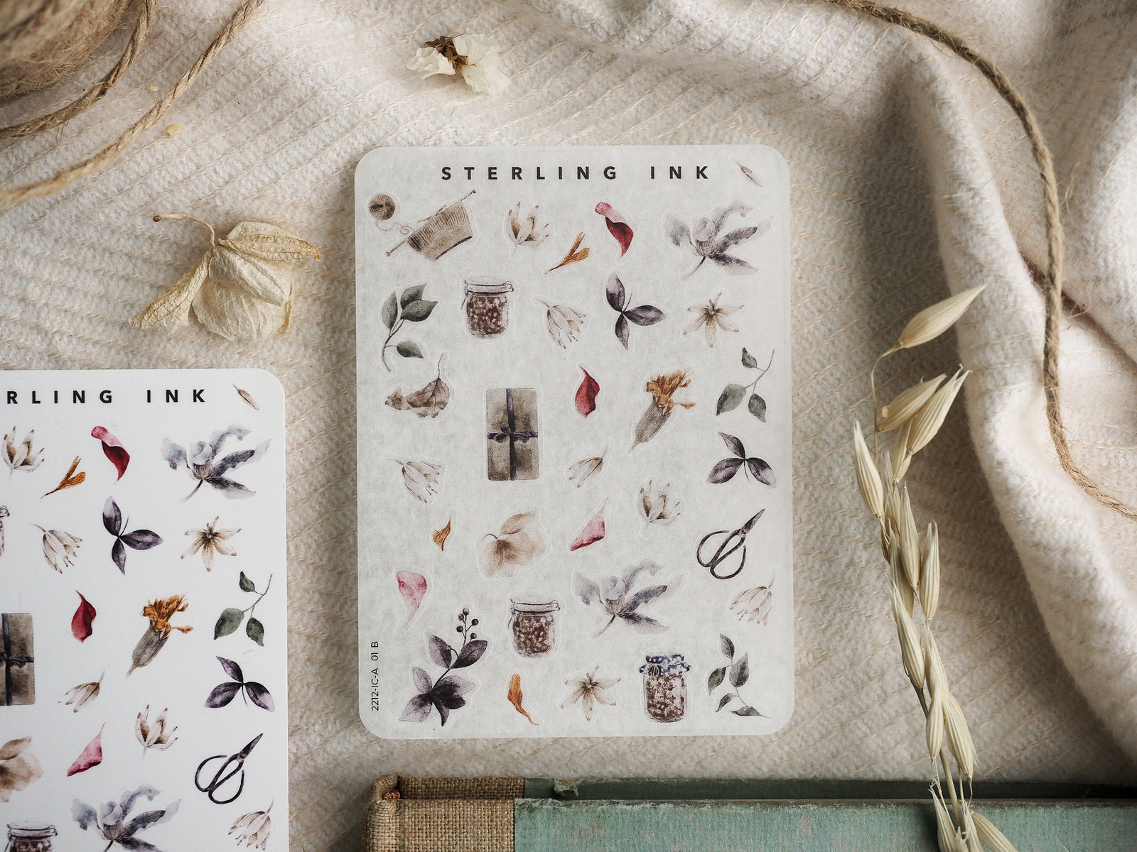 Mini sticker sheet featuring delicate botanical icons: tiny jars, dried autumn leaves, and muted floral elements perfect for scrapbooking and crafting.