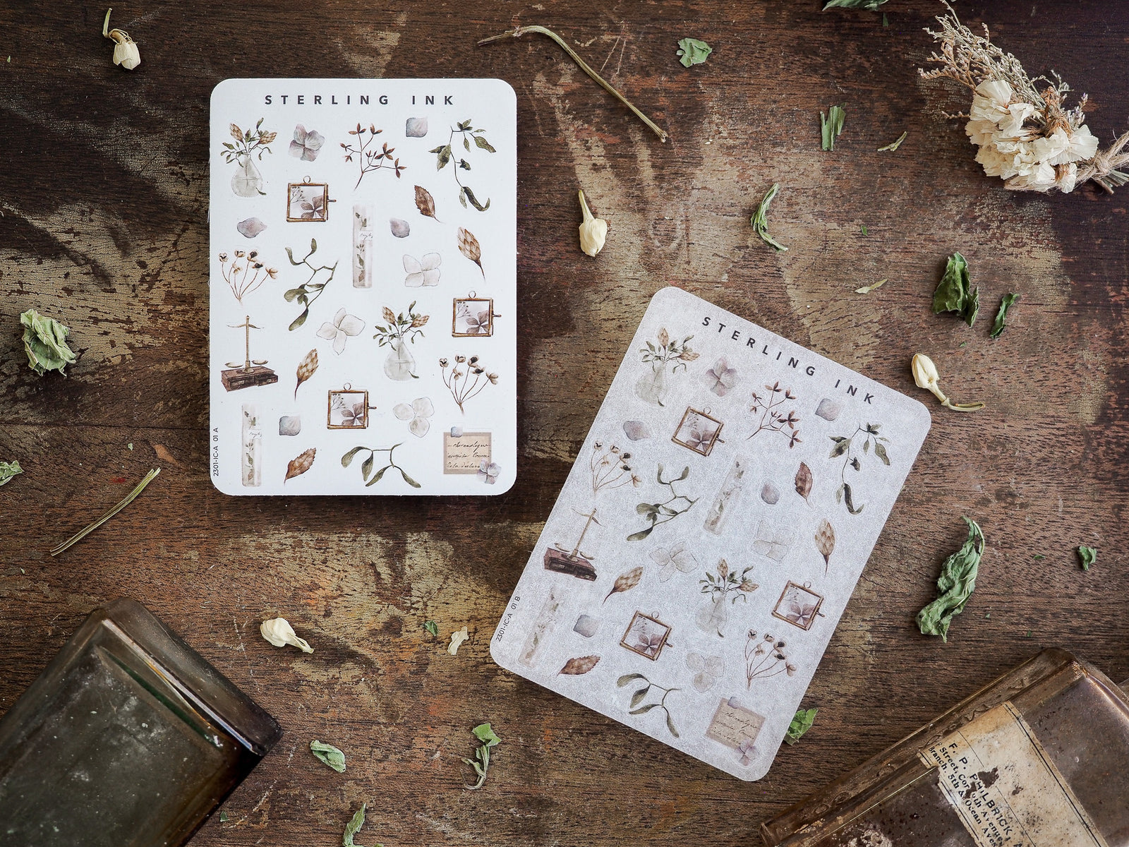 Miniature sticker set featuring delicate, hand-drawn botanical icons, including leaves, flowers, and rustic framed elements printed on clean white paper.