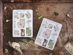 Collection of vintage-themed sticker sheets featuring botanical illustrations, ornate picture frames, and decorative icons in muted sepia and beige tones.