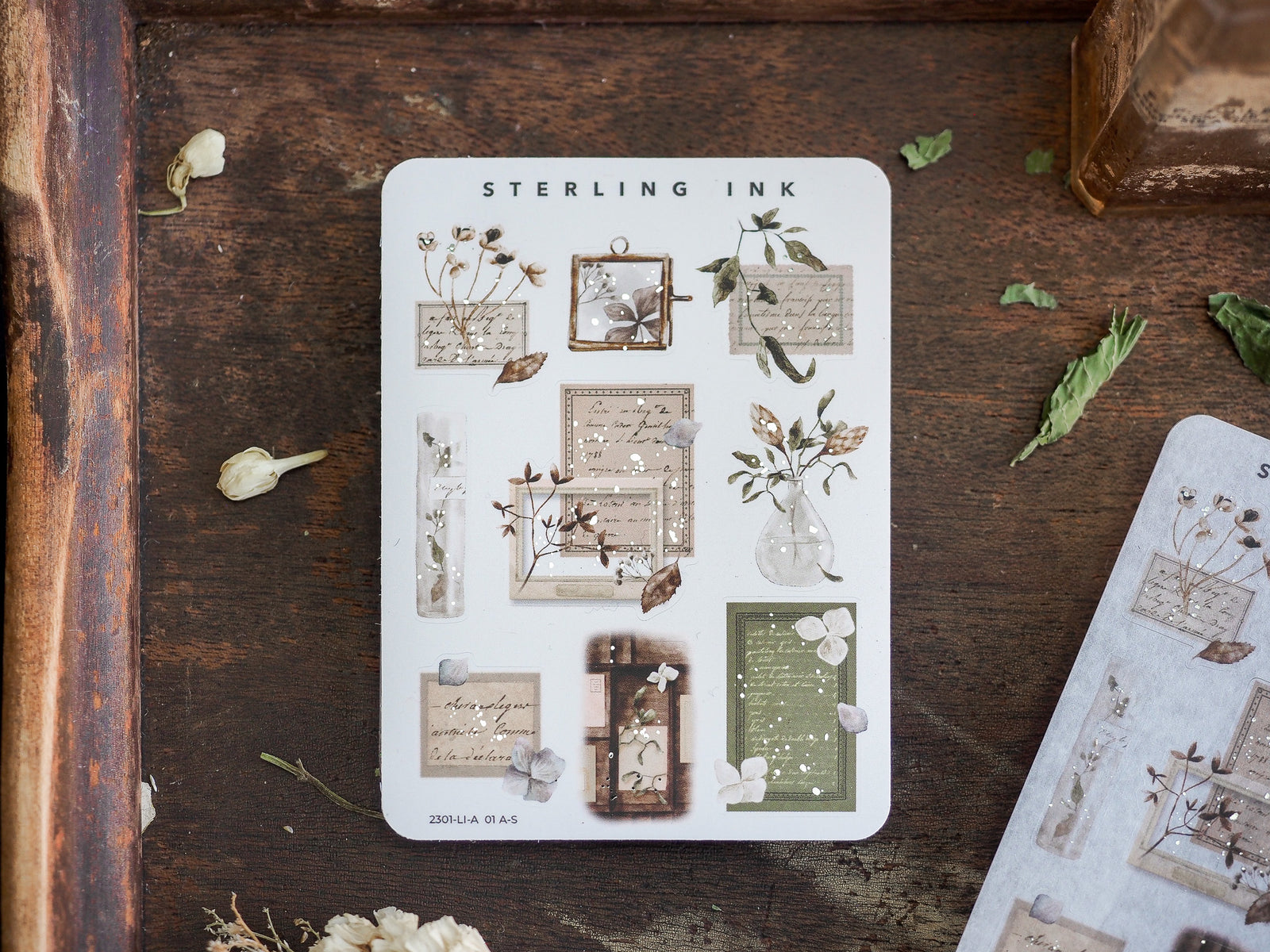 Botanical sticker sheet featuring dried flowers, watercolor botanicals, vintage script, and delicate silver foil accents for journaling and scrapbooking.