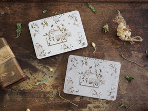 Delicate botanical corner decals featuring silver foil accents and charming clusters of greenery and small leaves, perfect for journaling or scrapbook decoration.