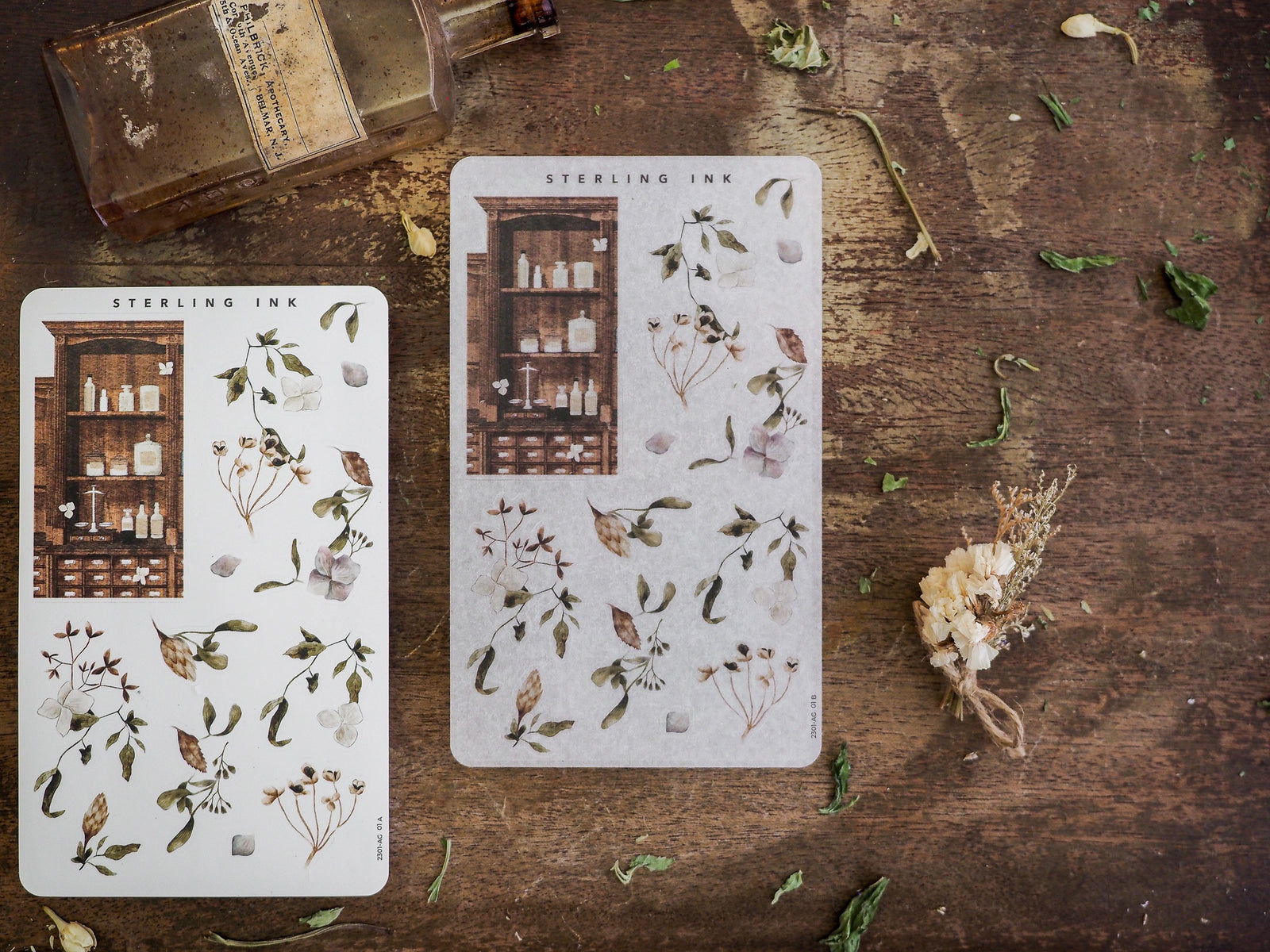 Sticker assortment featuring muted tones and delicate pressed botanicals, including dried herbs and vintage apothecary cabinet designs perfect for seasonal scrapbooking.