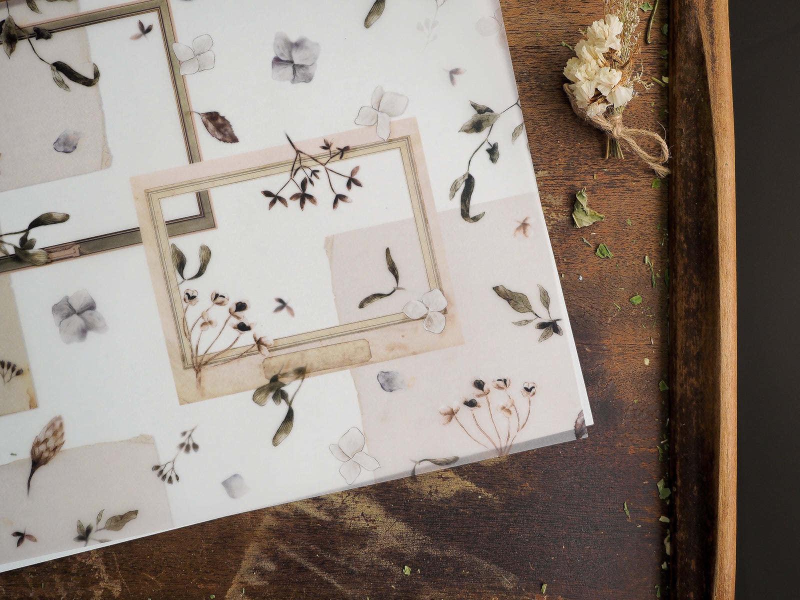 Soft cream botanical accent sheet featuring delicate vintage floral illustrations, muted leaves, and framed spring-themed seasonal layouts.