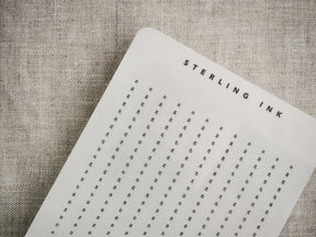 Off-white tracker strips featuring a clean, numbered grid layout designed for common planners, allowing users to track dates vertically and horizontally.