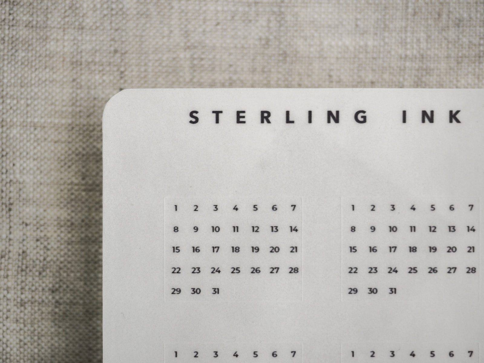 Minimalist monthly tracker page featuring a clean black and white calendar grid, perfect for journaling and structured daily planning.