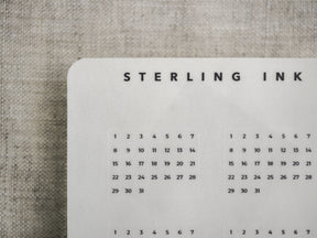 Minimalist monthly tracker page featuring a clean black and white calendar grid, perfect for journaling and structured daily planning.