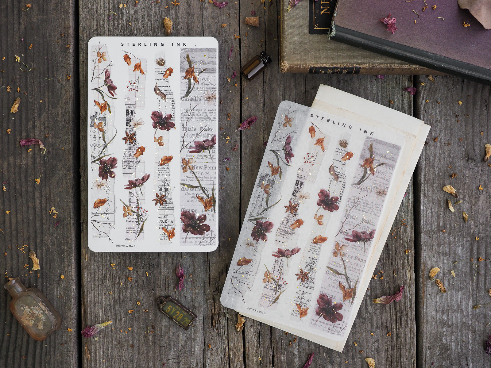 Vintage washi sticker strips with a botanical theme, featuring sepia-toned illustrations of dark red and brown flowers printed over antique-style scientific text.