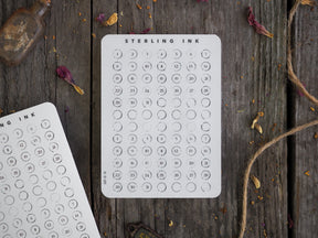 Clean white monthly planner stickers for November 2022, featuring a crisp black, organized grid of 30 numbered date circles for journaling and scheduling.